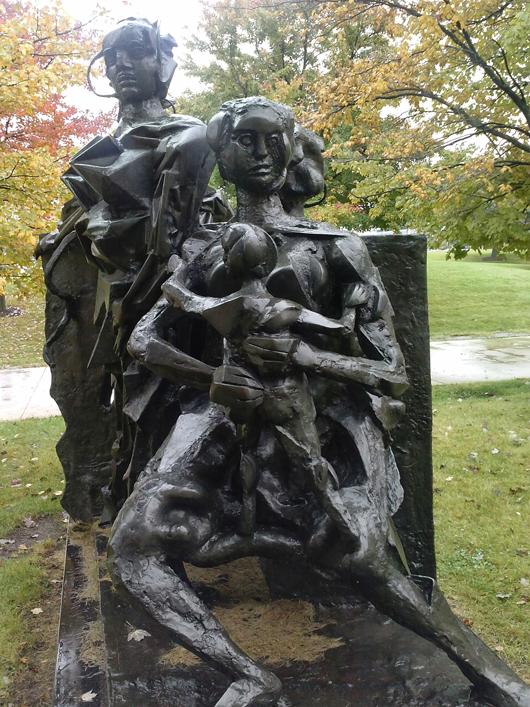 Sculpture of a family on campus